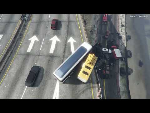 NPCs drive off overpass and explode — wild GTA 5 bug screenshot